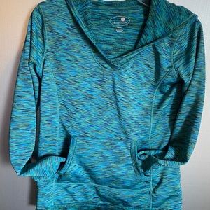 Hoodie in Turquoise/ Green with muted colors to create pattern. Sz M